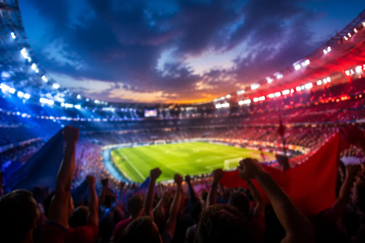Editorial sports news header image, blurred background of a packed World Cup football stad
