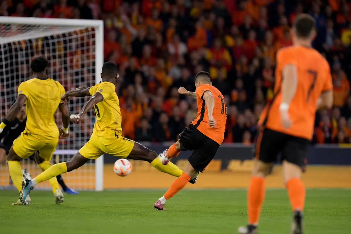 Editorial news photo of a professional football match, two teams in generic orange and yel