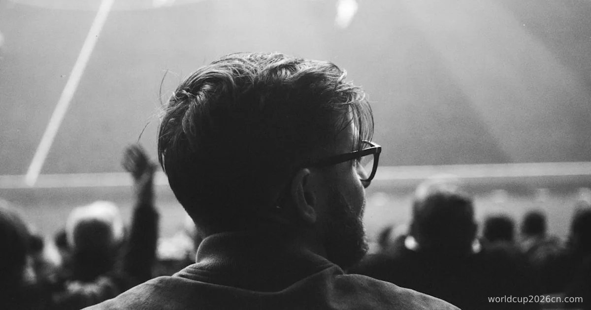 a black and white photo of a man at a soccer game
